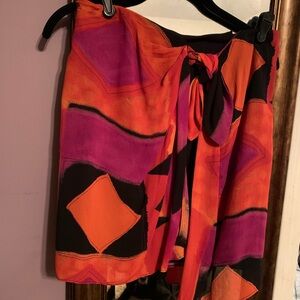 Adorable skirt with a wraparound strong that is attached.